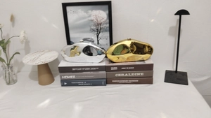 Detail of irregular pebble-shaped evening clutch bags in metallic gold and silver finish
