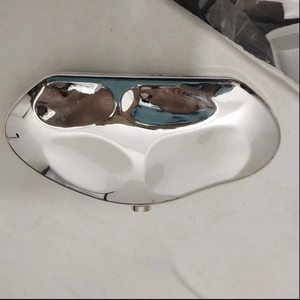 Close-up of the smooth mirror-finish silver acrylic ornament on a stylish crossbody bag