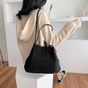 Chic black cable knit shoulder bag for women with leather strap and minimalist design