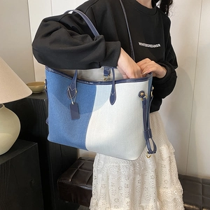 Stylish large capacity denim tote bag for women with minimalist blue and white color block