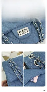 Close-up of denim quilted texture with silver rectangular twist lock and chain strap
