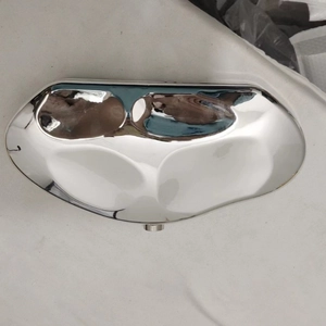 Modern irregular mirror-polished metal jewelry tray with a sleek silver finish