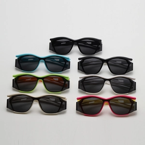 Flat lay of seven colorful sport sunglasses for children showing various frame colors