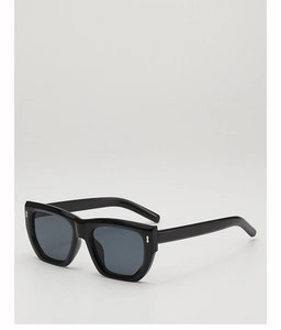 Detail of black polygon sunglasses with silver rivets and glossy acetate frame