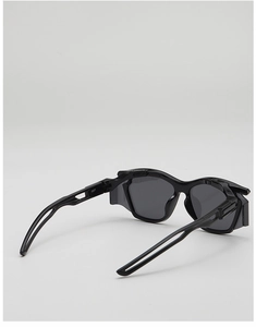 Detail view of black tactical kids sunglasses showing side shields and model 3827 on temple