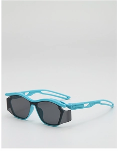 Close-up of vibrant blue sporty kids sunglasses featuring streamlined cutout frame detail