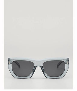 Detail of trendy polygonal sunglasses with clear grey-blue frames and silver metal accents