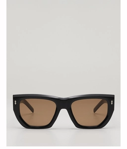 Close-up of black acetate frame showing the signature silver arrow rivets and brown lenses