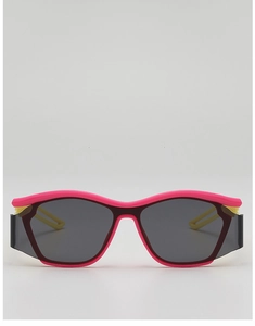 Close-up of pink sport sunglasses with yellow accents and gray anti-UV lenses
