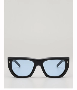 Detailed front view of thick black frame sunglasses with light blue transparent lenses