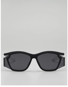 Front detail of black matte kids sports sunglasses with wide side light shields