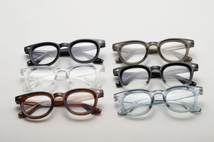 Detailed close-up of retro eyewear frames with metal rivet accents in six assorted colors