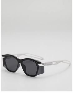 Detail of high-tech kids sports sunglasses with black frame and white hollowed-out temples