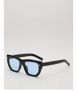 Detail of black polygon sunglasses with silver sword-shaped metal rivets on the temples