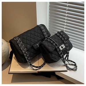 Quilted denim chain flap bags in large and small sizes with silver hardware and turn-lock