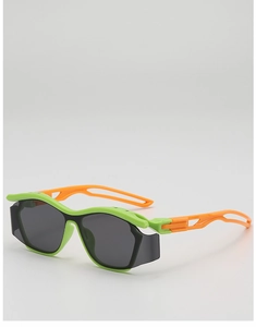 Detail of neon green sports sunglasses with orange cutout temples for kids
