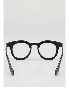 Detailed view of polished black full-rim retro glasses frame with glossy finish