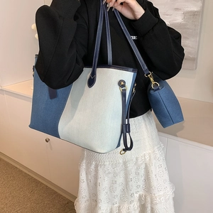 Minimalist denim tote bag with color-block design and matching small coin purse