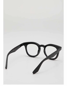 Detail view of black vintage eyewear frame featuring CE mark and sturdy metal hinges