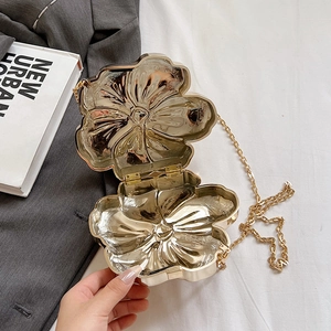Elegant gold flower evening bag with metallic finish and chain strap for women