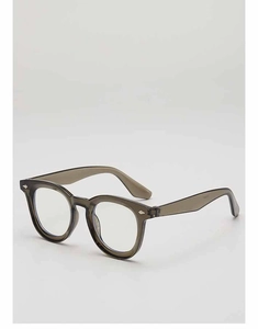 Detail of grey transparent retro frames featuring handcrafted inner temple markings
