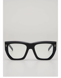 Detail of black acetate glasses frame with iconic metal arrow rivets and polished finish