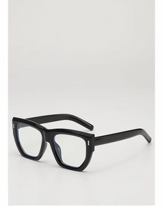 Detailed view of black thick-frame glasses with metallic rivets and blue light lenses
