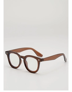 Detail view of translucent brown vintage eyewear with silver diamond-shaped rivets
