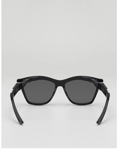 Close-up of matte black wide-frame kids sunglasses with protective dark grey lenses