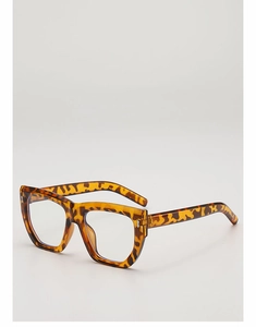 Detail of tortoise shell square glasses frame with metallic dot accents and thick acetate texture