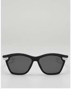 Close-up of kids sports sunglasses with black wave frames and white temples for outdoors