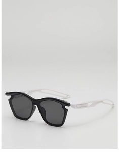 Detail of white streamlined temple with cutout design on kids sports sunglasses