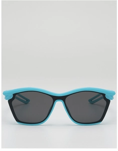 Detail of blue sport sunglasses for kids featuring UV protection and dark grey lenses