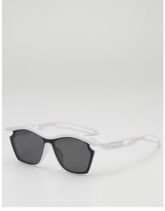 Detailed side view of white sports sunglasses showing the hollow temple structure and lens