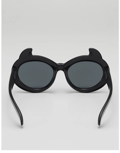 Detail of black cartoon little devil sunglasses with horn shaped frames for kids
