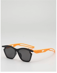 Detail of kids sports sunglasses with black frames, orange temples and hollow structure