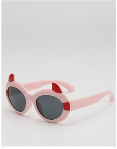Detail shot of kids pink cartoon sunglasses featuring red devil horns and round lenses