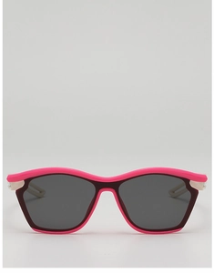 Close-up of stylish pink and black wave-frame kids sunglasses with UV protection lenses