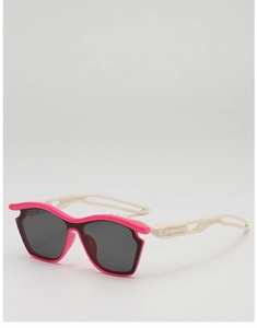 Close-up of pink and cream kids sports sunglasses with UV protection lenses