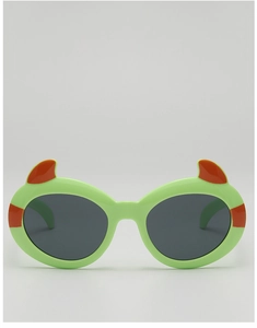 Close-up of lime green cartoon devil sunglasses with orange horns for kids' Halloween