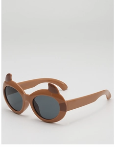 Detail of brown cartoon little devil sunglasses for children with bear ears and round lenses