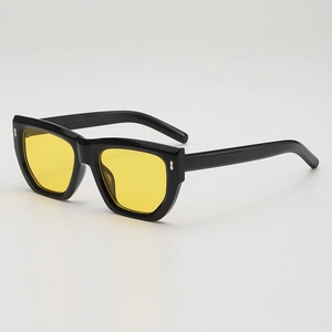 Chic black polygon sunglasses with vibrant yellow lenses and silver metal rivets
