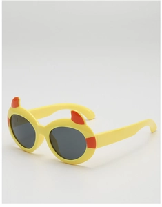 Detail of yellow kids devil horn sunglasses with orange accents and dark lenses