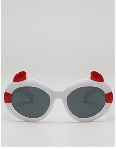 Detail of cartoon demon horns on white frame sunglasses with red stripe accents