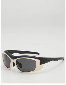Detail of kids sports sunglasses with black and cream contrast frame and wrap design