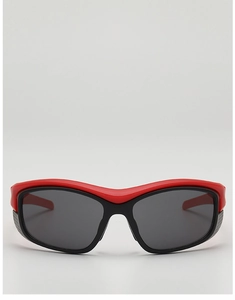 Close-up of red and black futuristic sports sunglasses with dark lenses for outdoor cycling