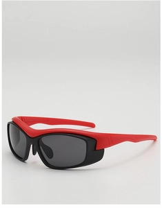 Detail view of red and black futuristic sports sunglasses with ergonomic wrap-around frame