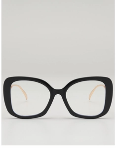 Close-up of stylish large black frame glasses with premium gold metal temple detail