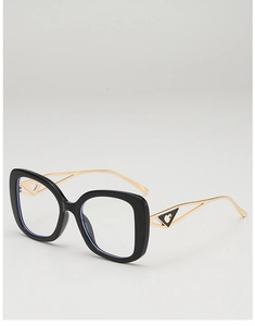 Detail of gold metal temples with triangle and heart cutout design on black frames