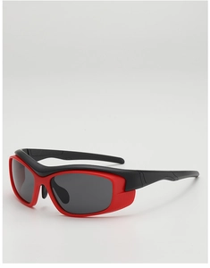 Detail of kids sport sunglasses with black and red frame and side wind shields